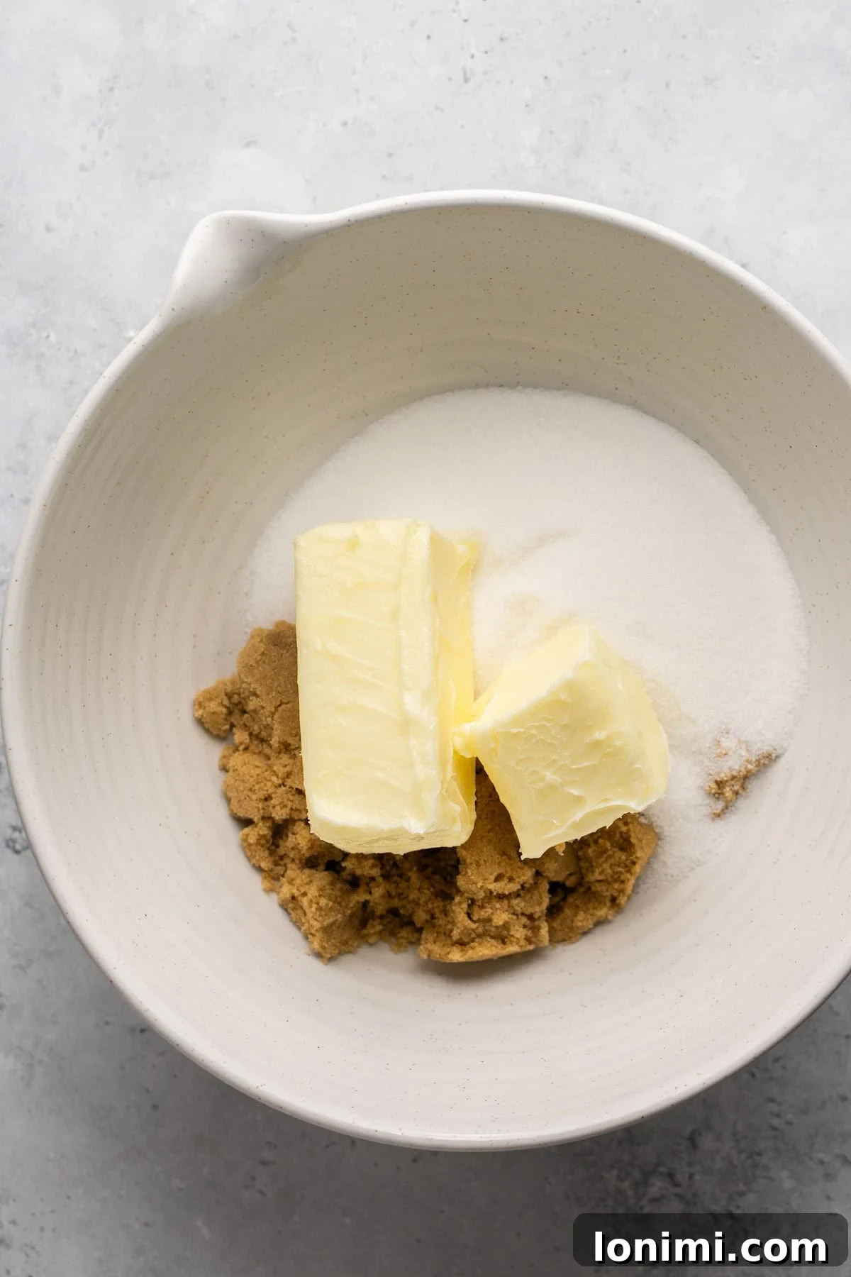 Softened butter, granulated sugar, and light brown sugar in a large mixing bowl.