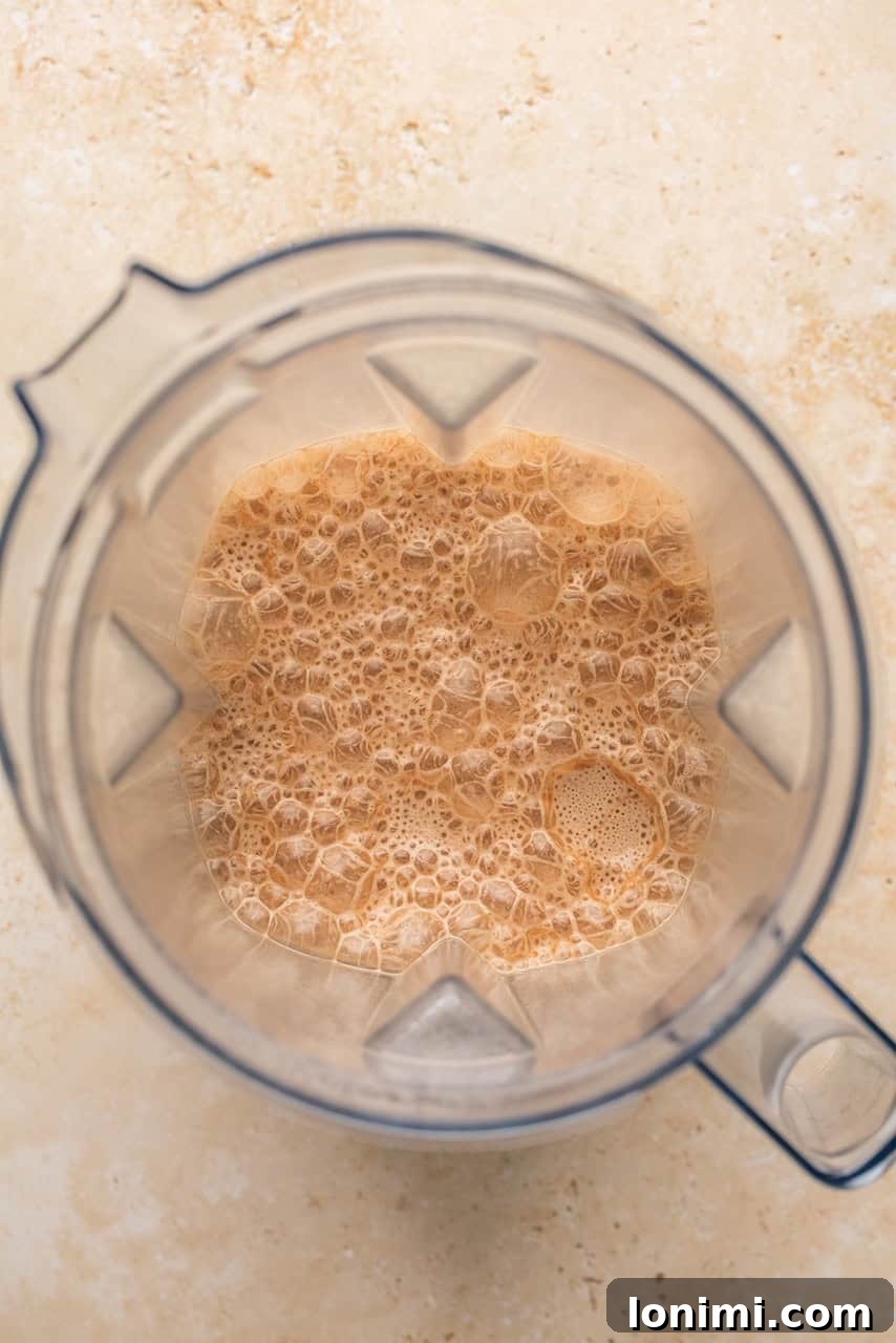 Collagen Cocoa Elixir 6 frothy hot chocolate in a blender