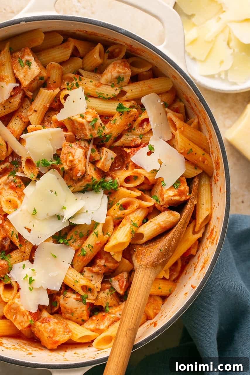 A close-up of a pot of penne vodka with chicken