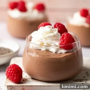 A side view of chocolate protein chia pudding in a jar