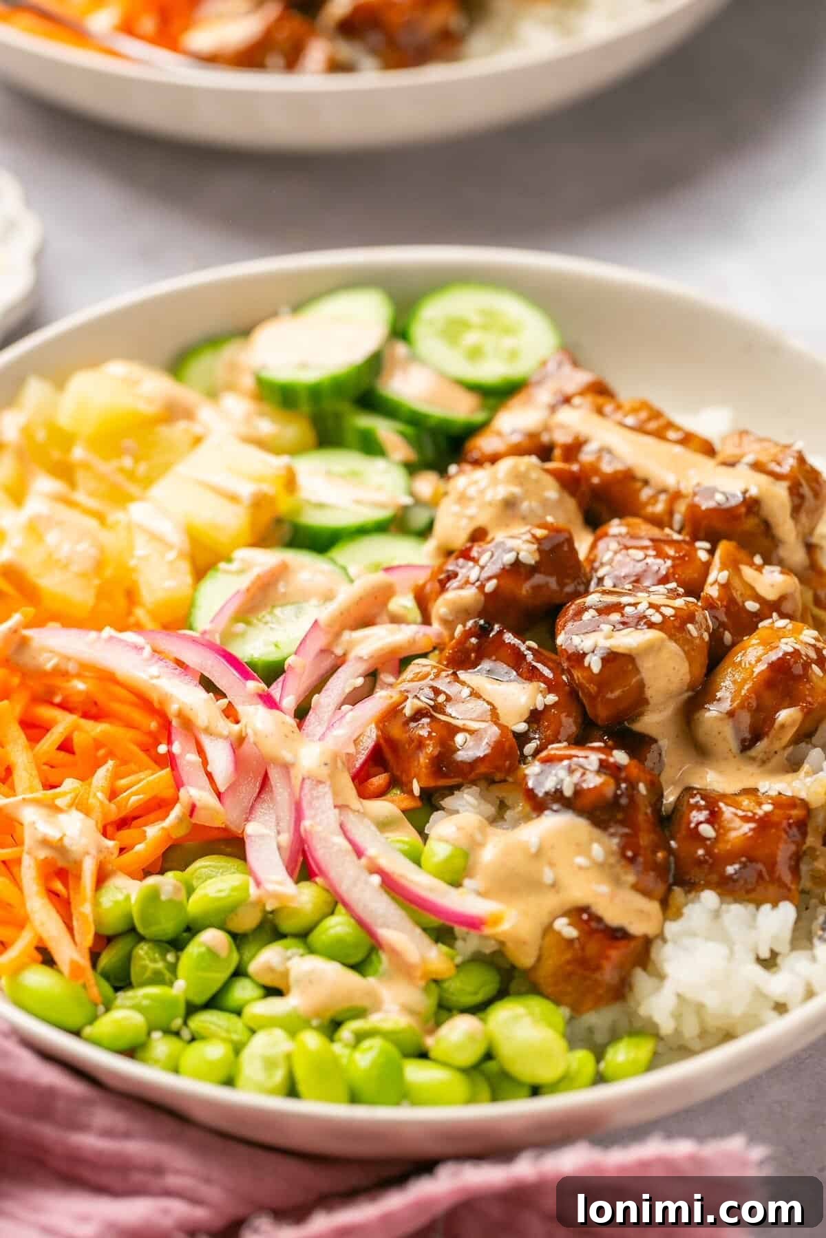 Effortless Teriyaki Chicken Poke Bowls with Fiery Sriracha Mayo 6 Side view of chicken poke bowls