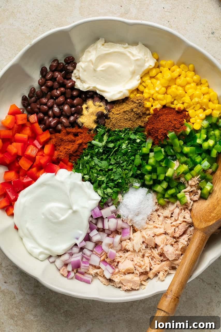 Vibrant Healthy Mexican Tuna Salad 4 All prepared ingredients for Mexican tuna salad combined in a large mixing bowl, ready to be tossed.