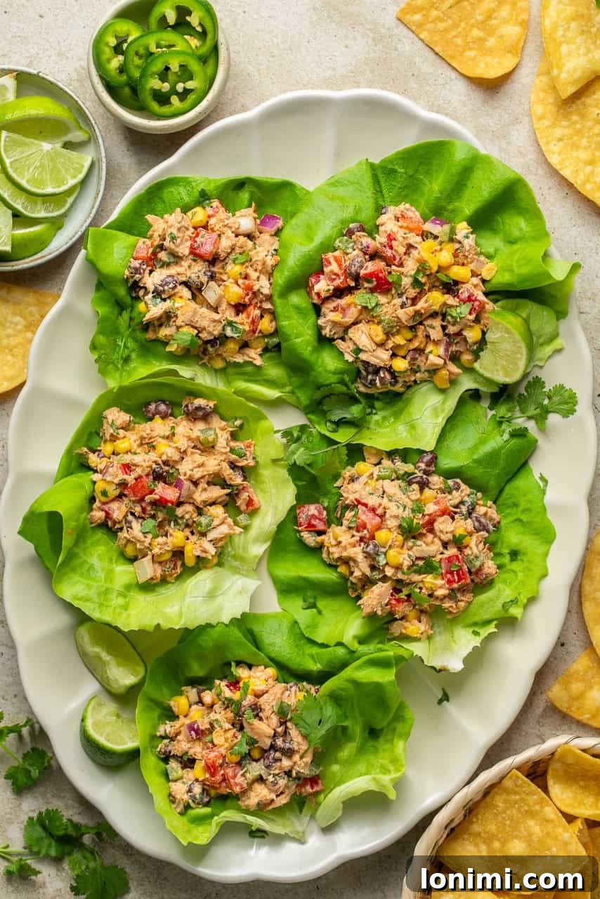 Vibrant Healthy Mexican Tuna Salad 6 An overhead shot showcasing butter lettuce cups generously filled with the colorful southwest tuna salad.
