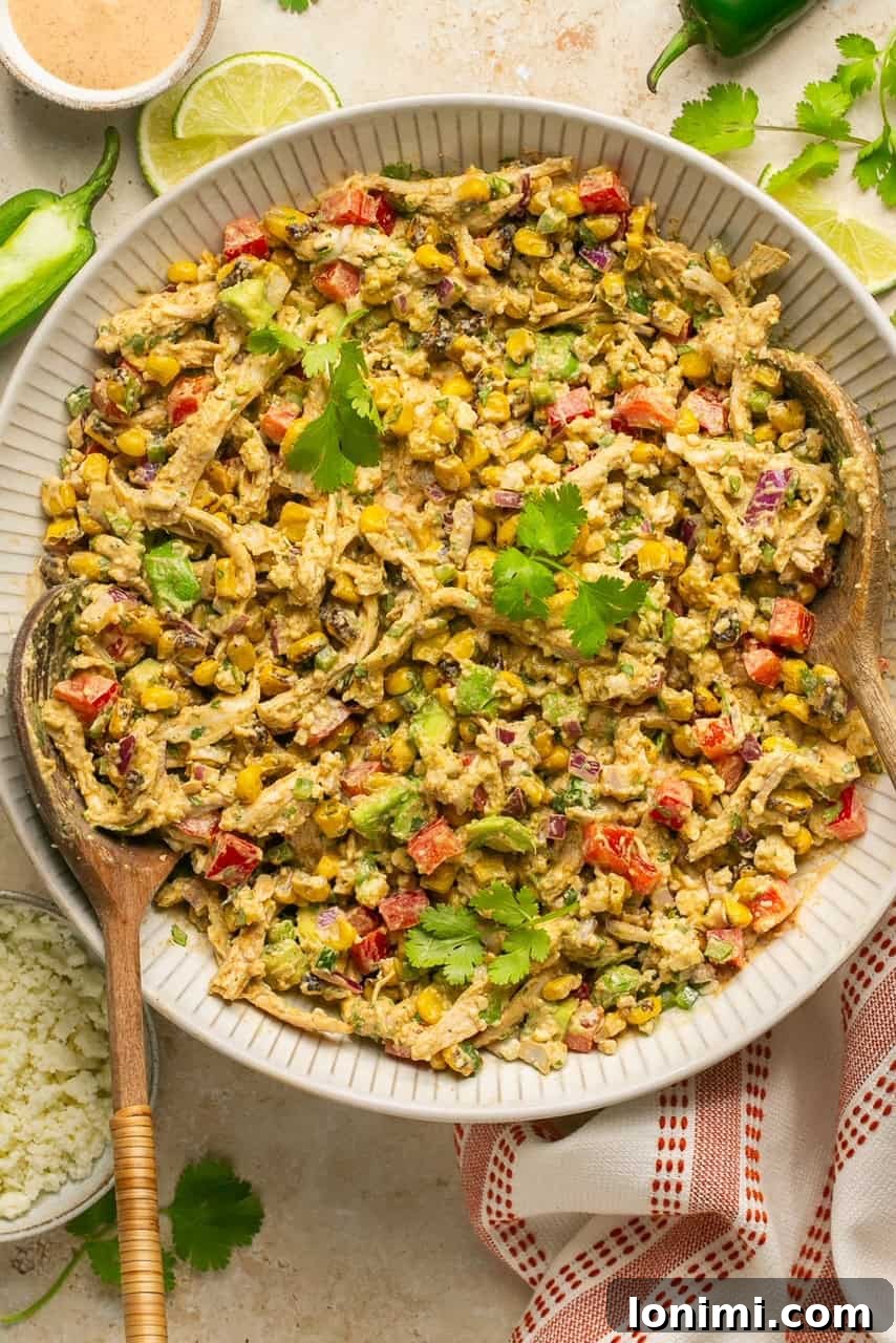 A perfectly tossed and ready-to-eat Mexican chicken salad in a large serving bowl