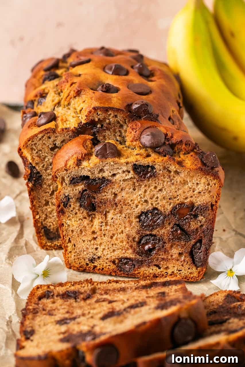 An up-close shot of a sliced protein banana bread, revealing its perfectly baked middle and moist texture.