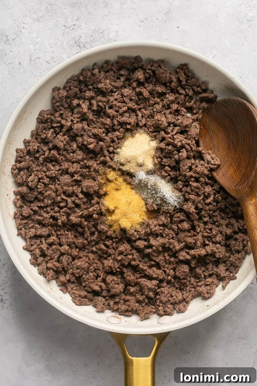 Bacon Cheeseburger Bowls Big Mac Style 5 Cooked ground beef, seasoned and crumbled, resting in a skillet after being drained.