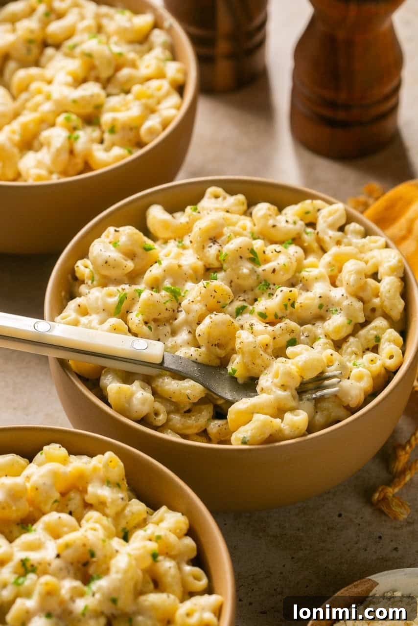 cottage cheese mac and cheese in a bowl with a spoon
