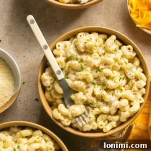 protein mac and cheese in a bowl with a fork