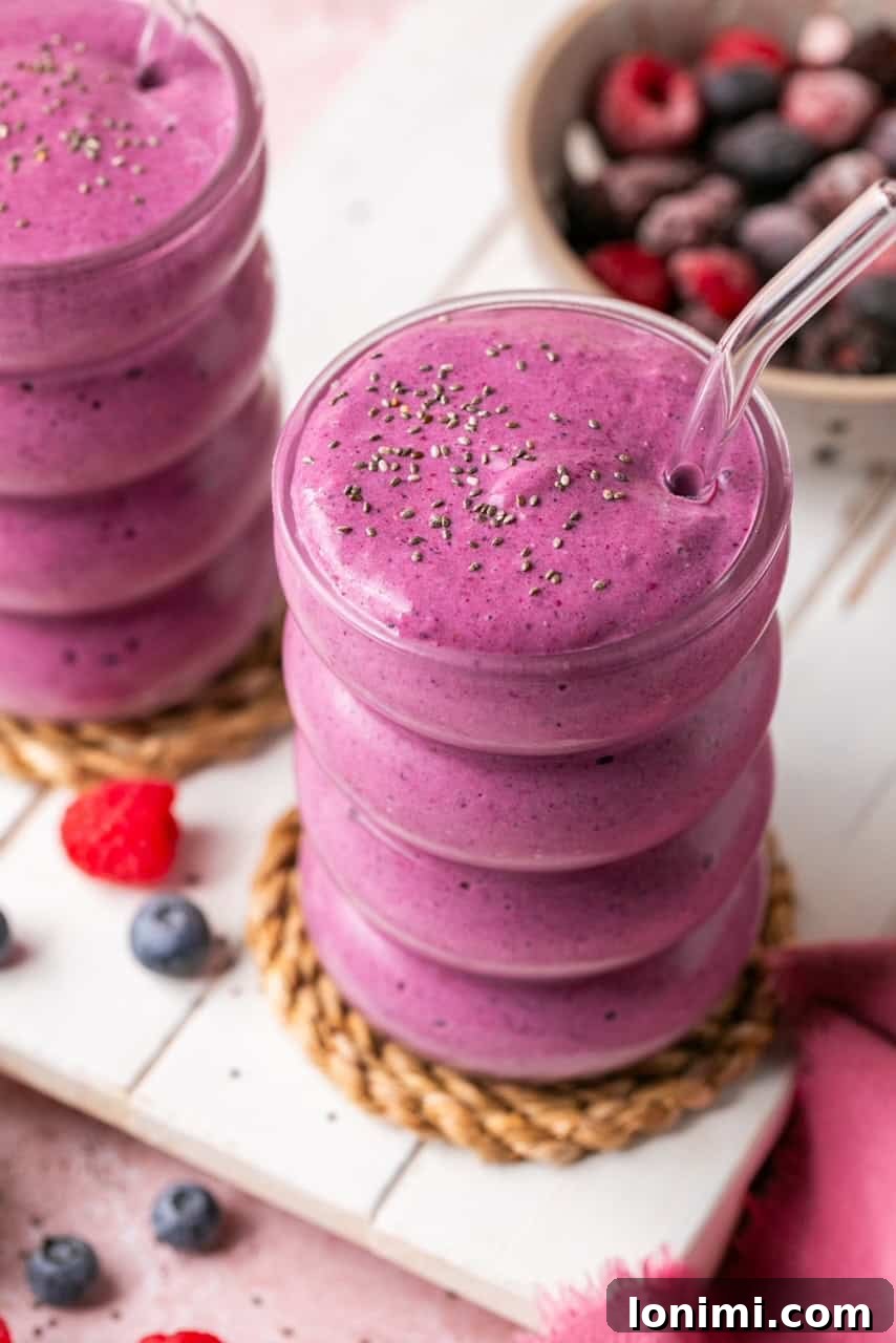 Berry Bliss Cottage Cheese Smoothie 2 2 cottage cheese smoothies with cottage cheese and frozen berries in glass cups with glass straws