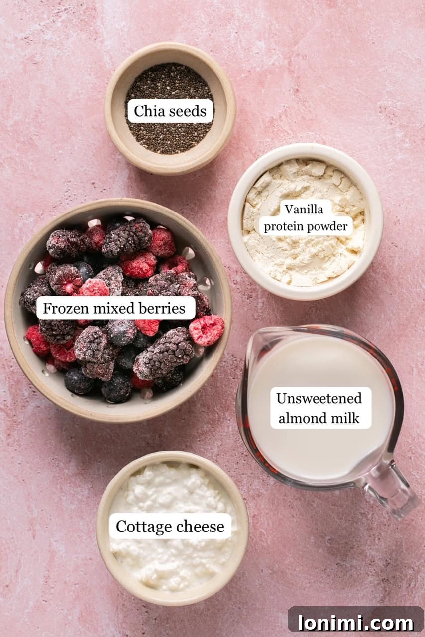 Berry Bliss Cottage Cheese Smoothie 3 recipe ingredients in small bowls and labeled