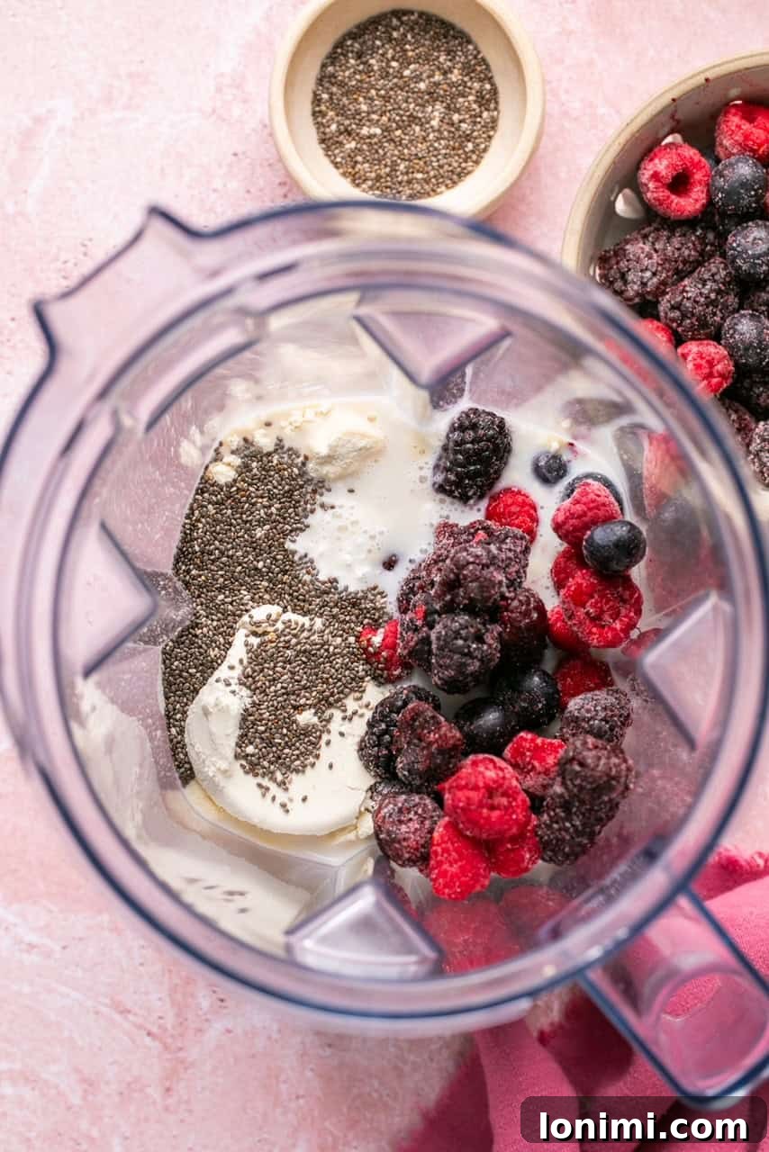 Berry Bliss Cottage Cheese Smoothie 4 recipe ingredients in a blender