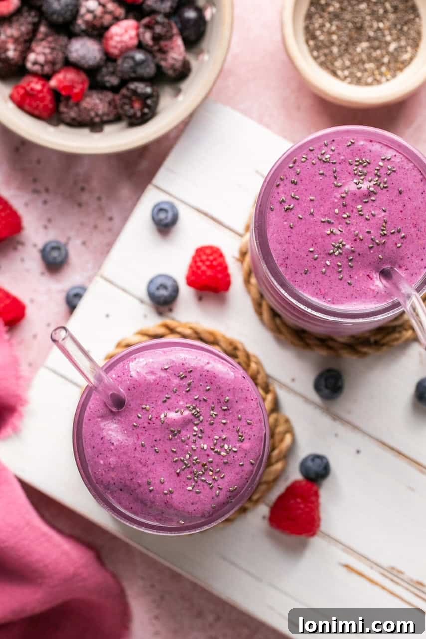 Berry Bliss Cottage Cheese Smoothie 7 an overhead shot of two smoothies topped with chia seeds