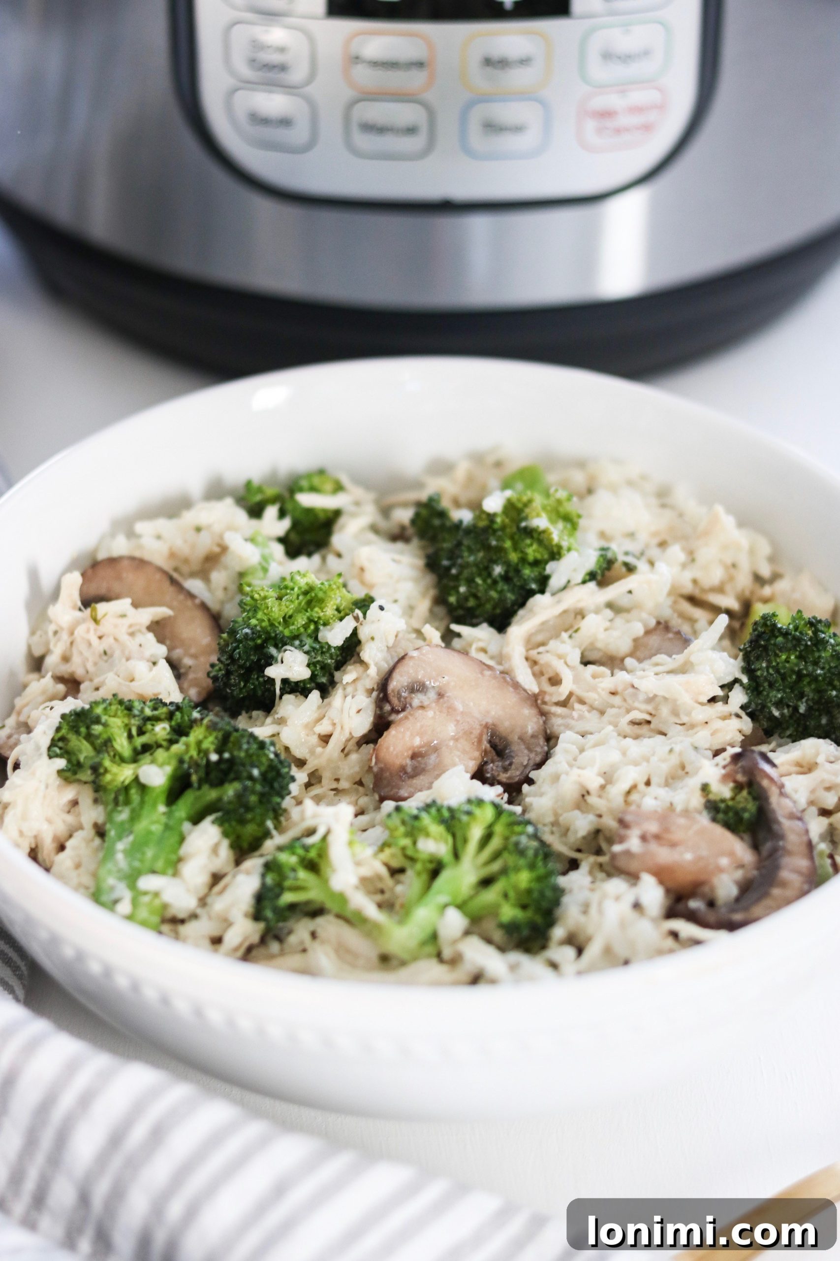 A serving of Instant Pot Chicken Broccoli & Rice Casserole, showcasing fresh ingredients.