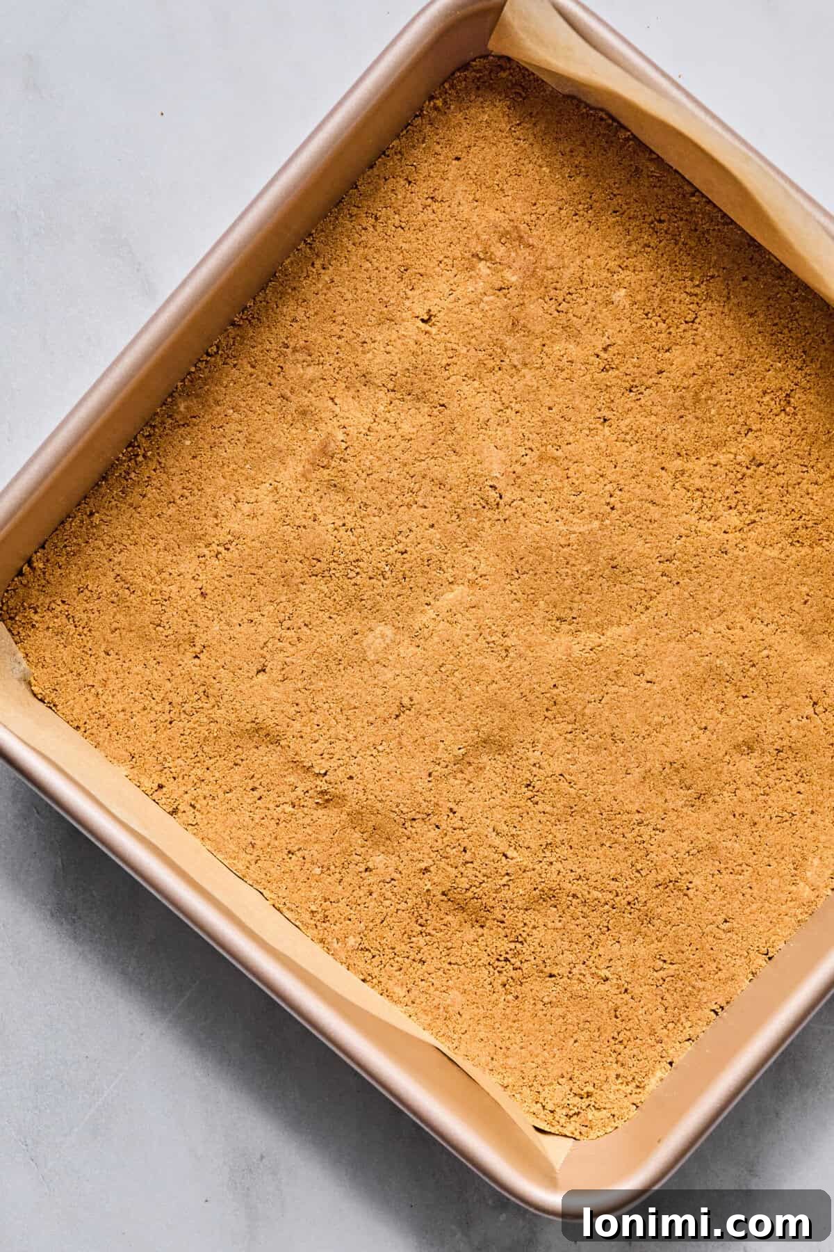 graham cracker crumbs pressed firmly into a square baking pan