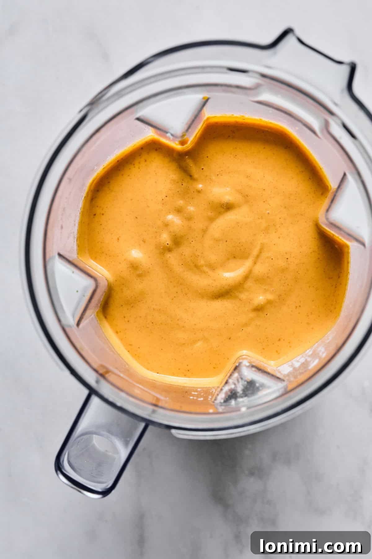 creamy pumpkin cheesecake filling in a blender