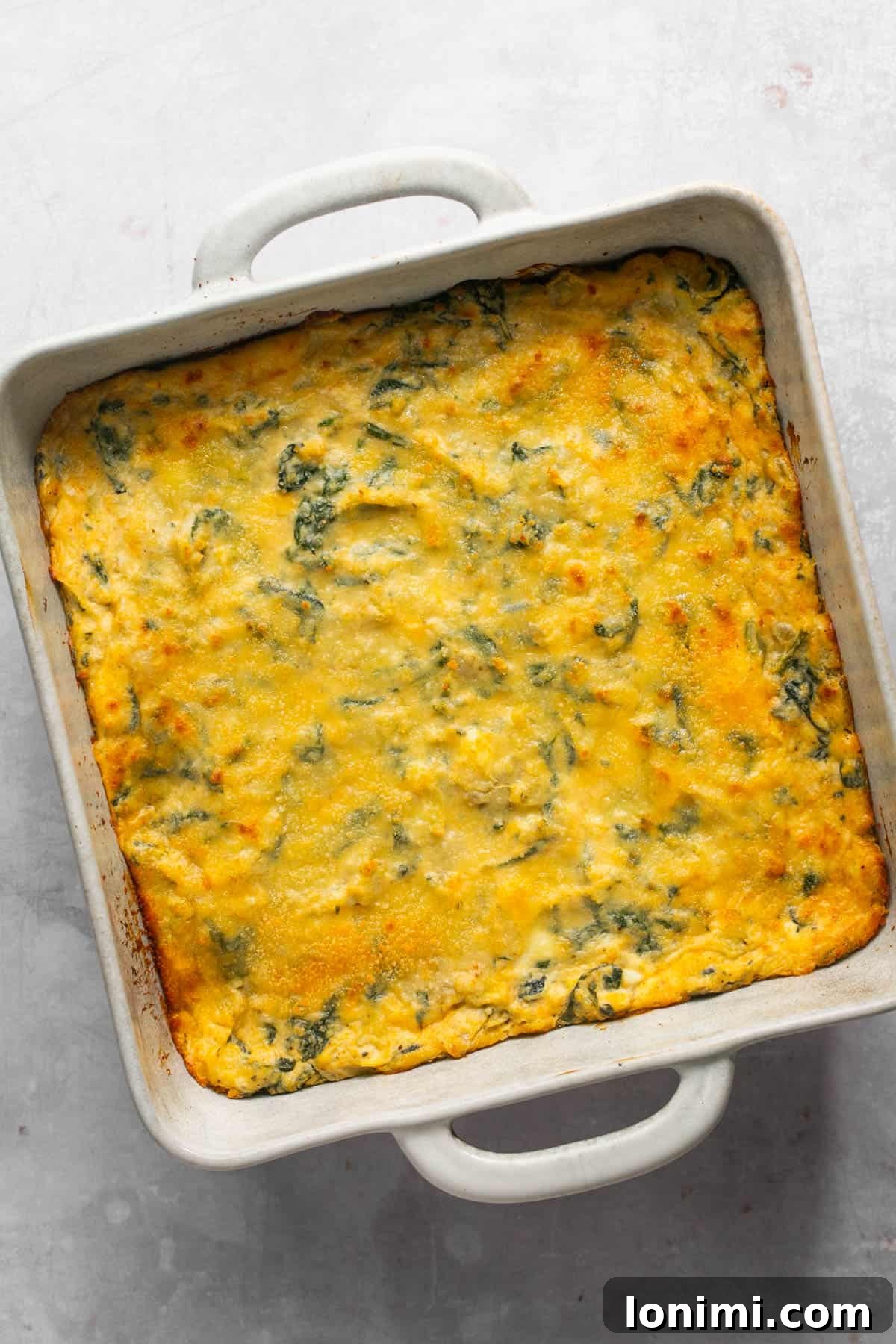 Decadent Mayo-Free Spinach Artichoke Dip 11 Baked spinach artichoke dip, golden brown and bubbling, fresh out of the oven