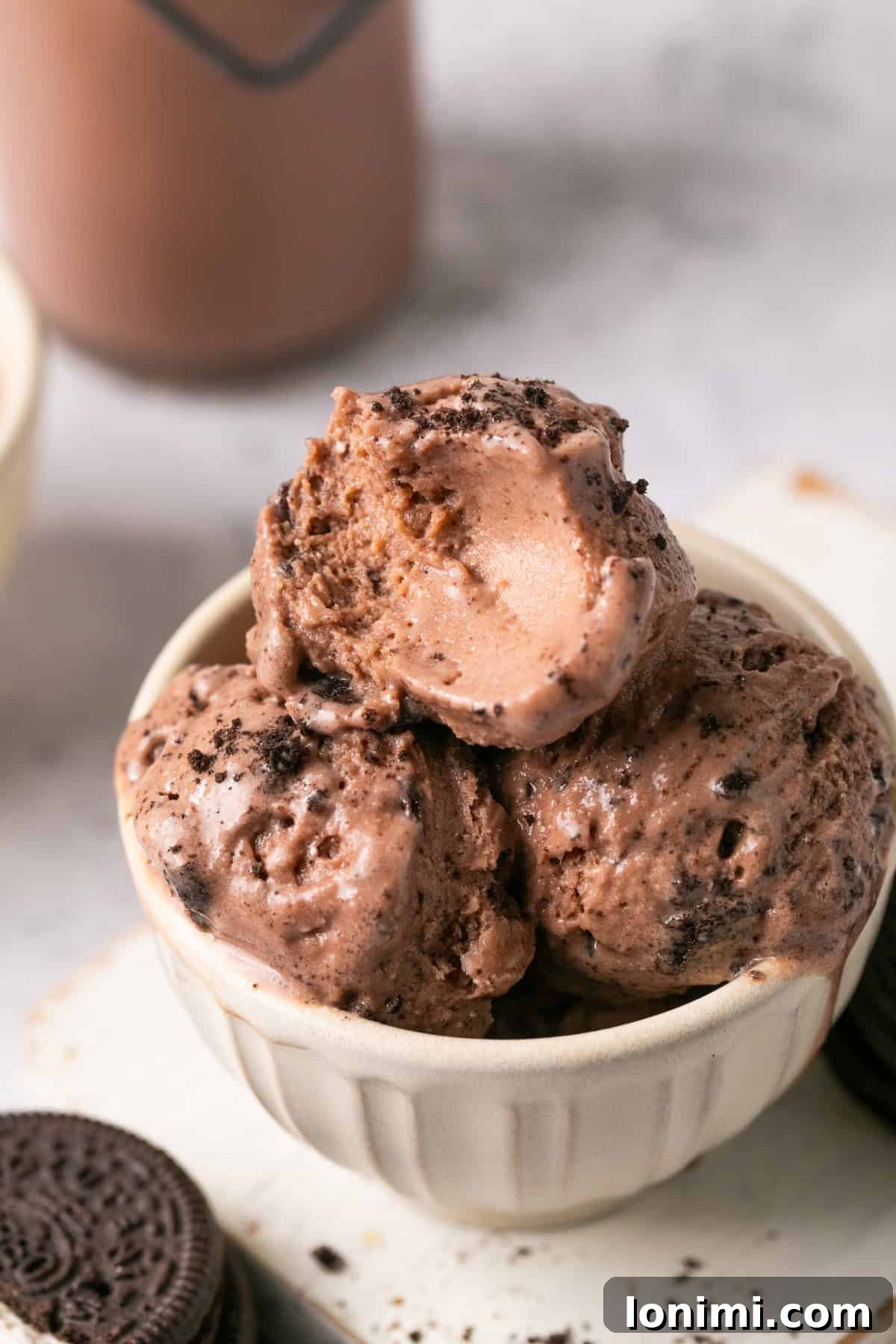 Easy Ninja Creami Protein Ice Cream with 4 Ingredients and 24g Protein 11 Three scoops of chocolate protein ice cream in a bowl