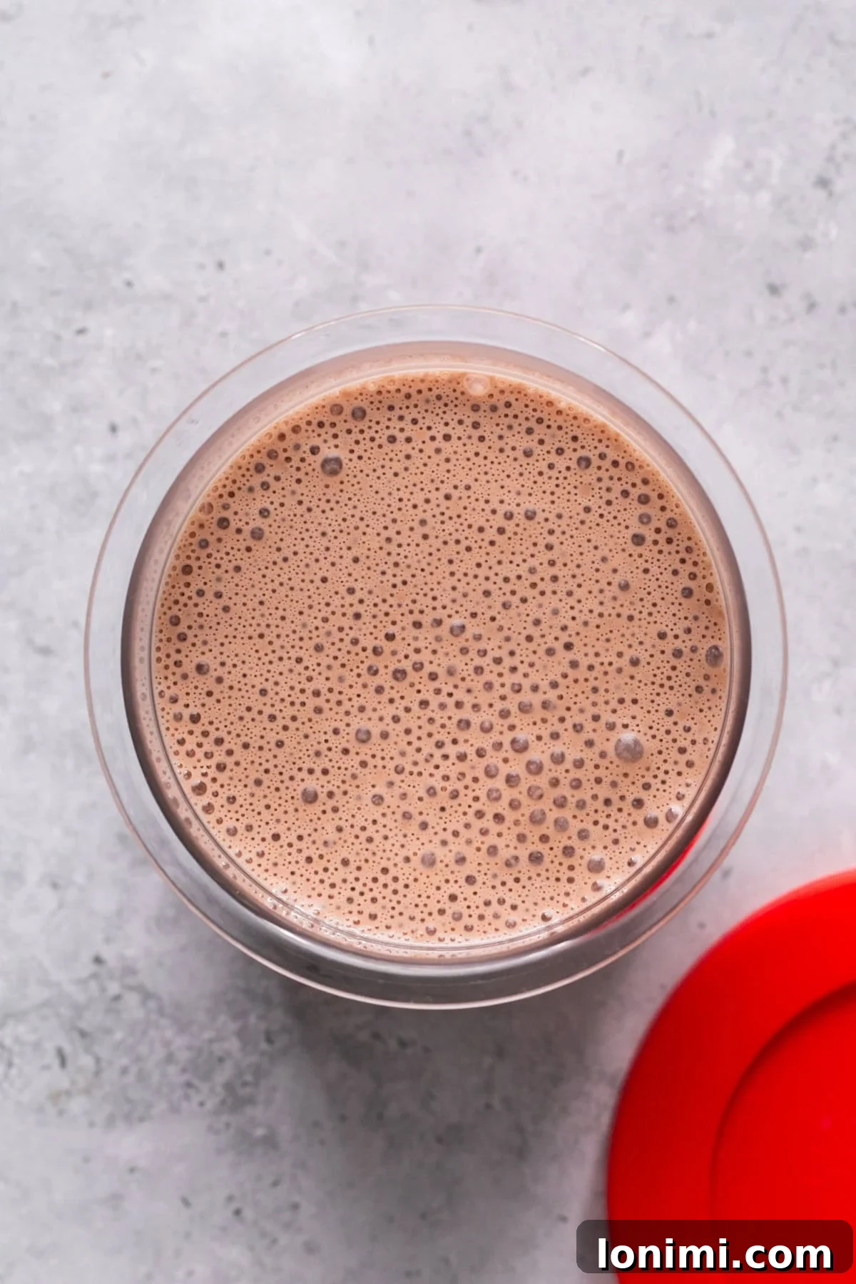 Easy Ninja Creami Protein Ice Cream with 4 Ingredients and 24g Protein 5 Contents of protein ice cream in the Ninja Creami container