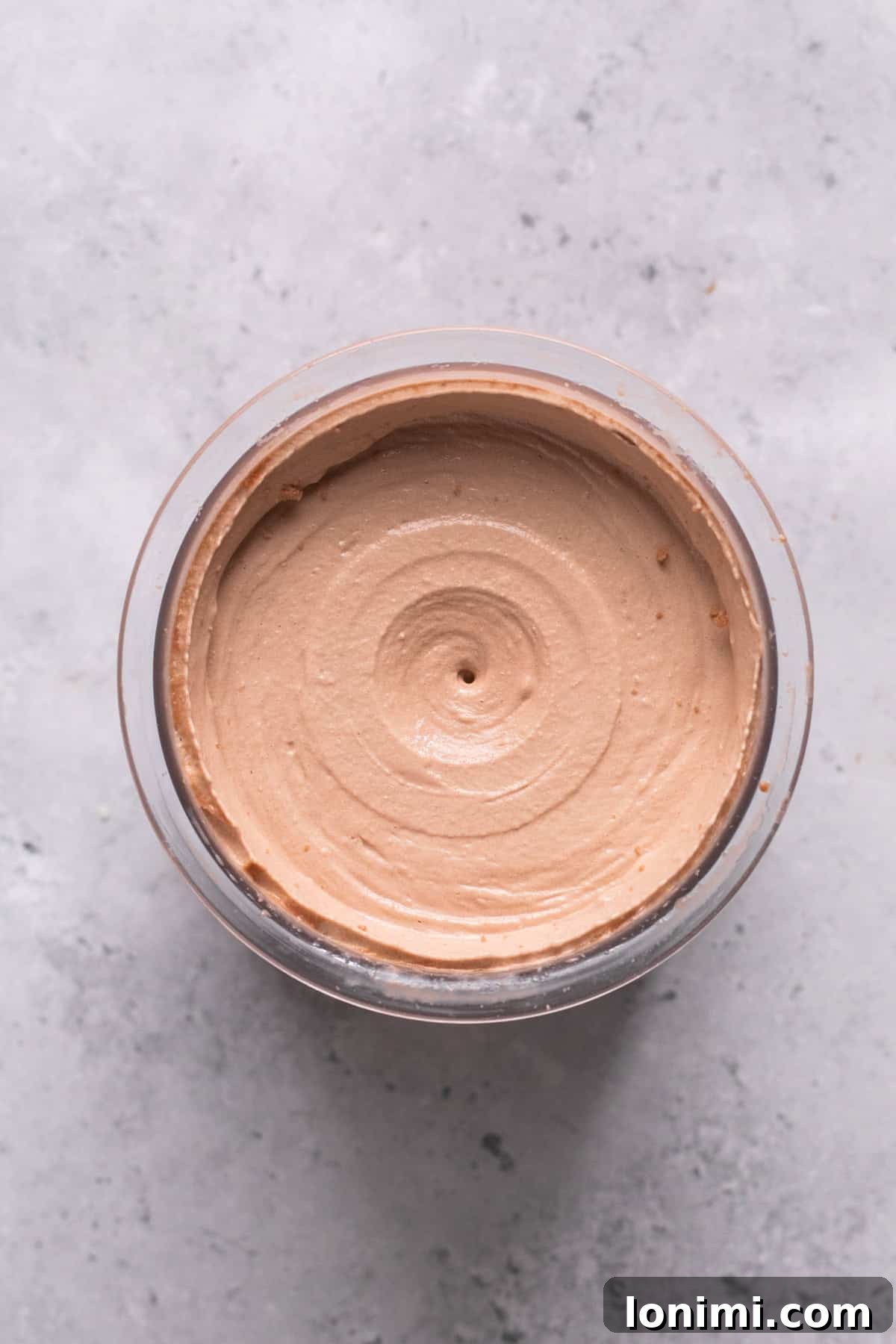 Easy Ninja Creami Protein Ice Cream with 4 Ingredients and 24g Protein 8 Smooth blended ice cream in a container