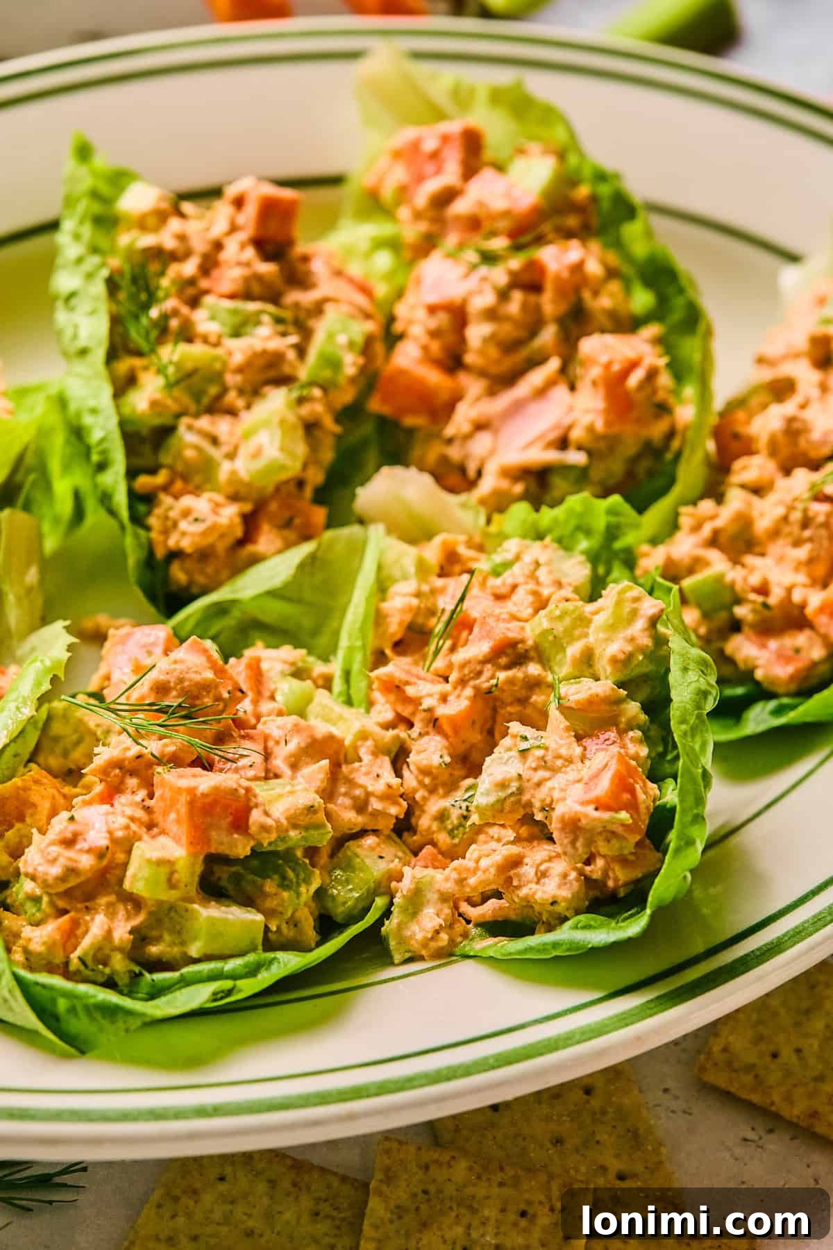lettuce cups filled with tuna salad on a large platter