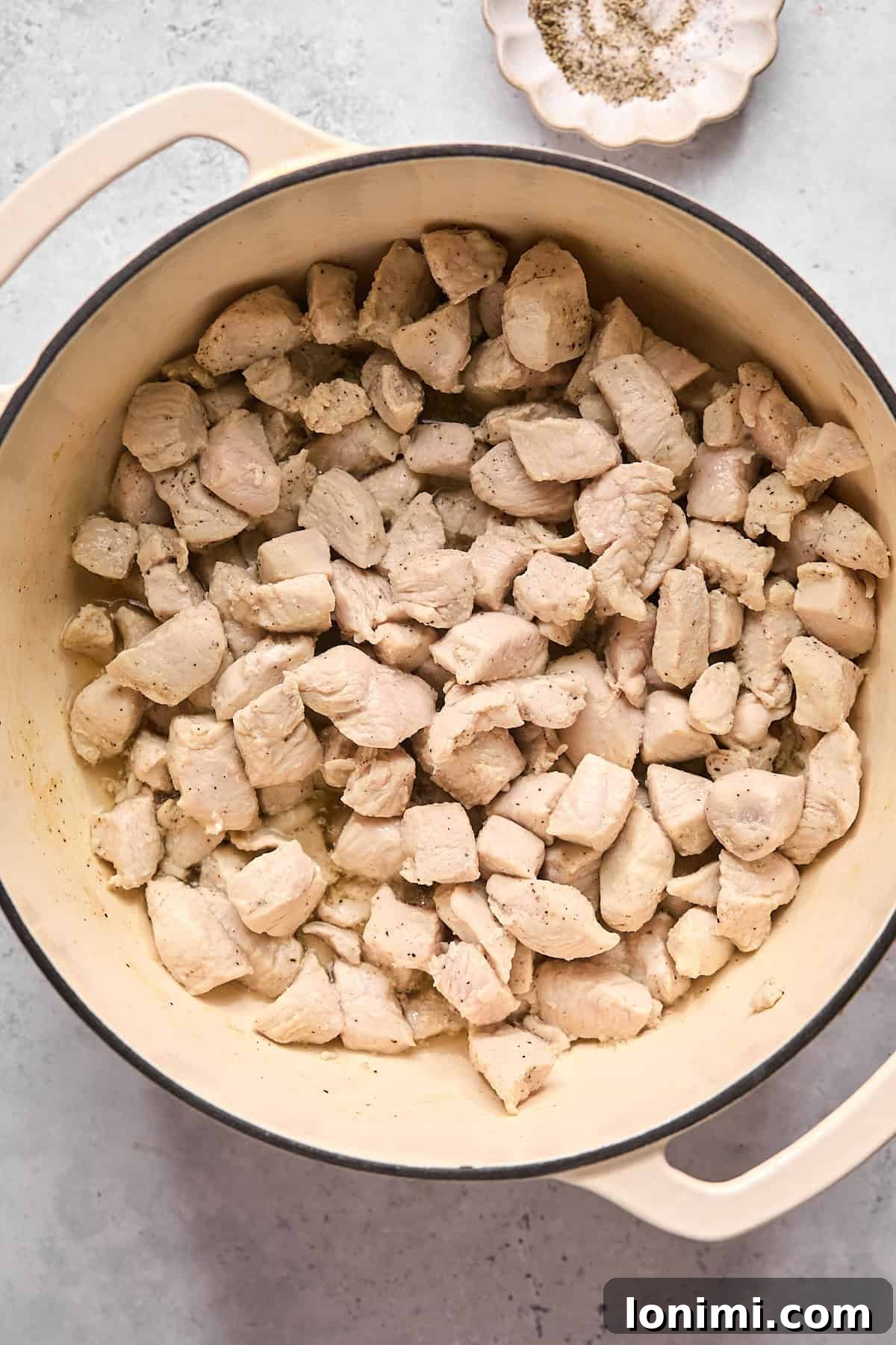 chicken pieces in a dutch oven pot