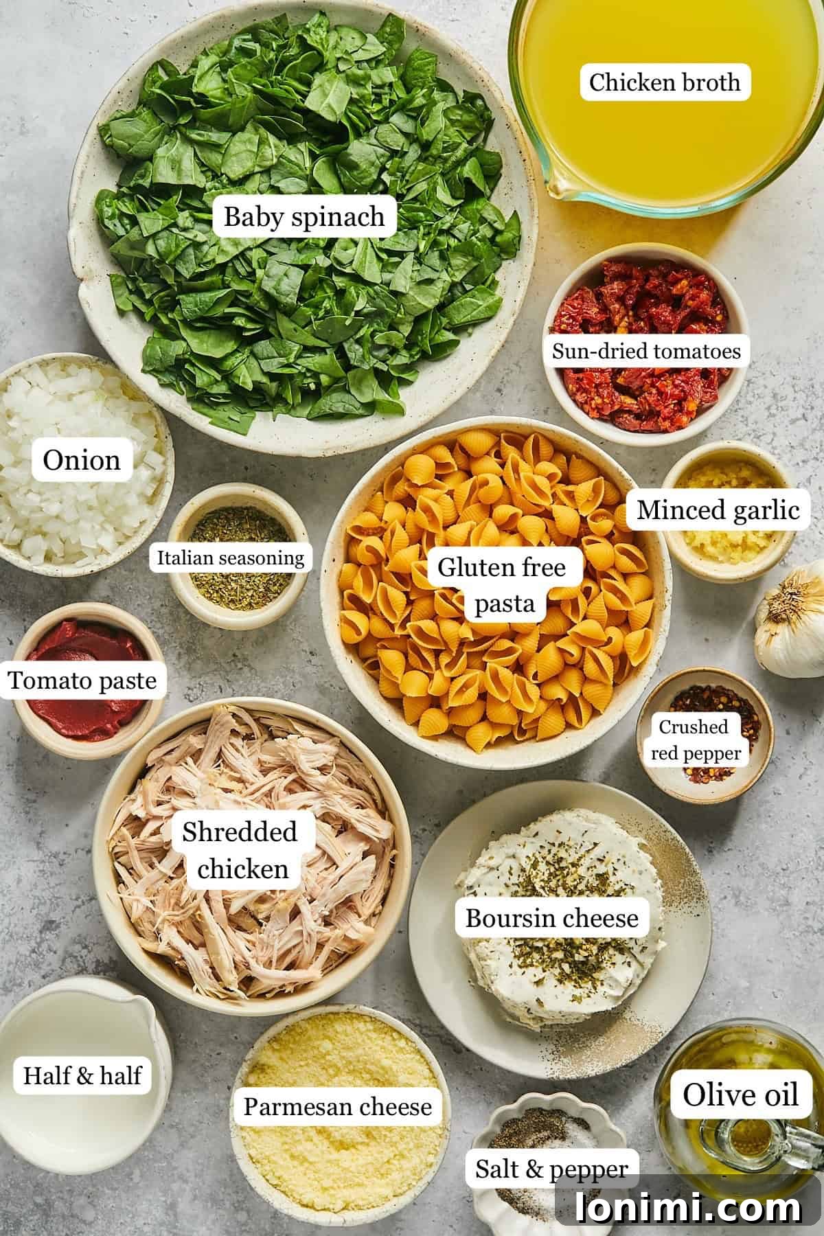 An array of fresh, colorful ingredients like onions, garlic, spinach, sun-dried tomatoes, and various seasonings, neatly portioned into small bowls for the Marry Me Chicken Soup recipe.