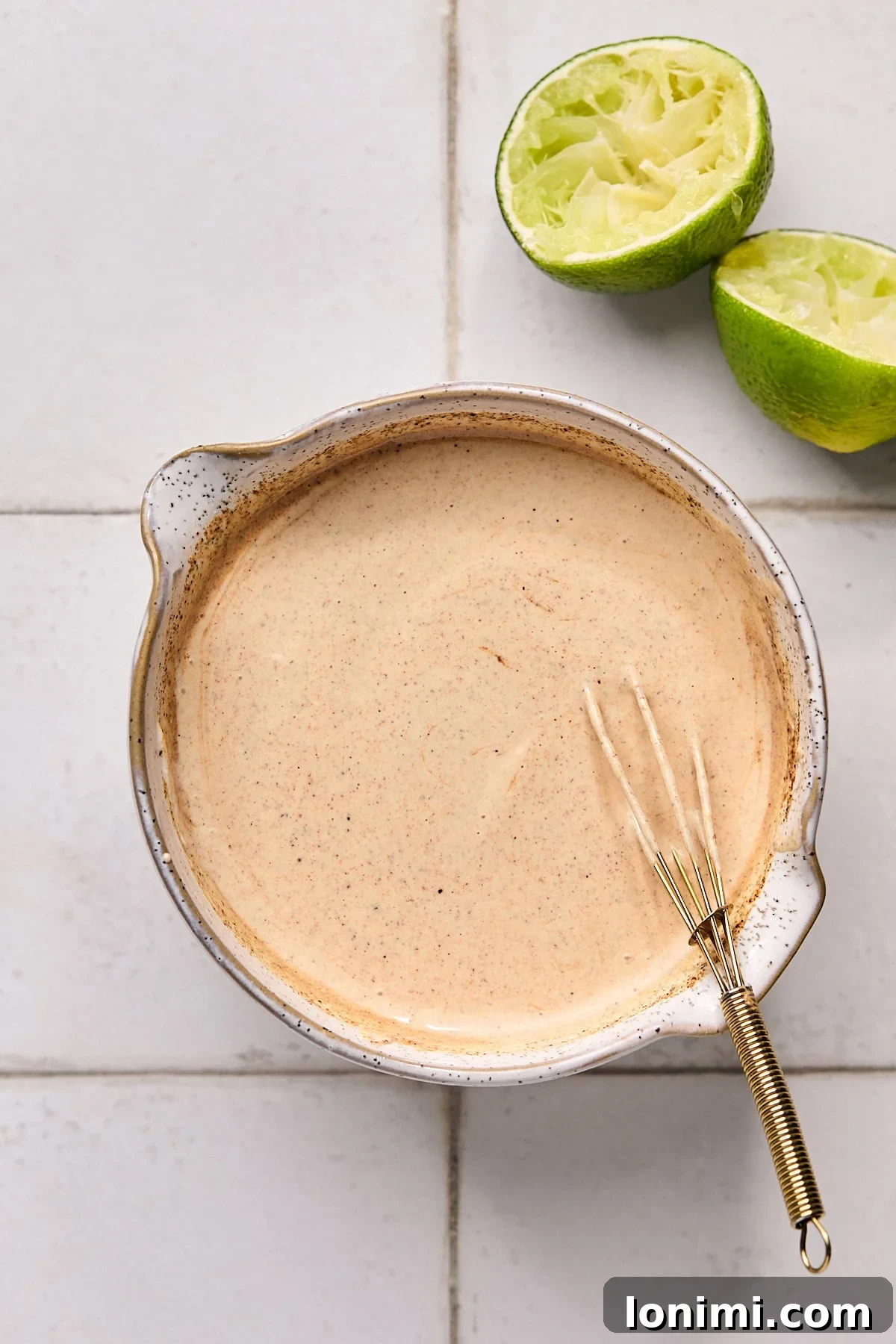 The creamy, tangy Baja sauce, beautifully mixed and smooth, presented in a bowl.