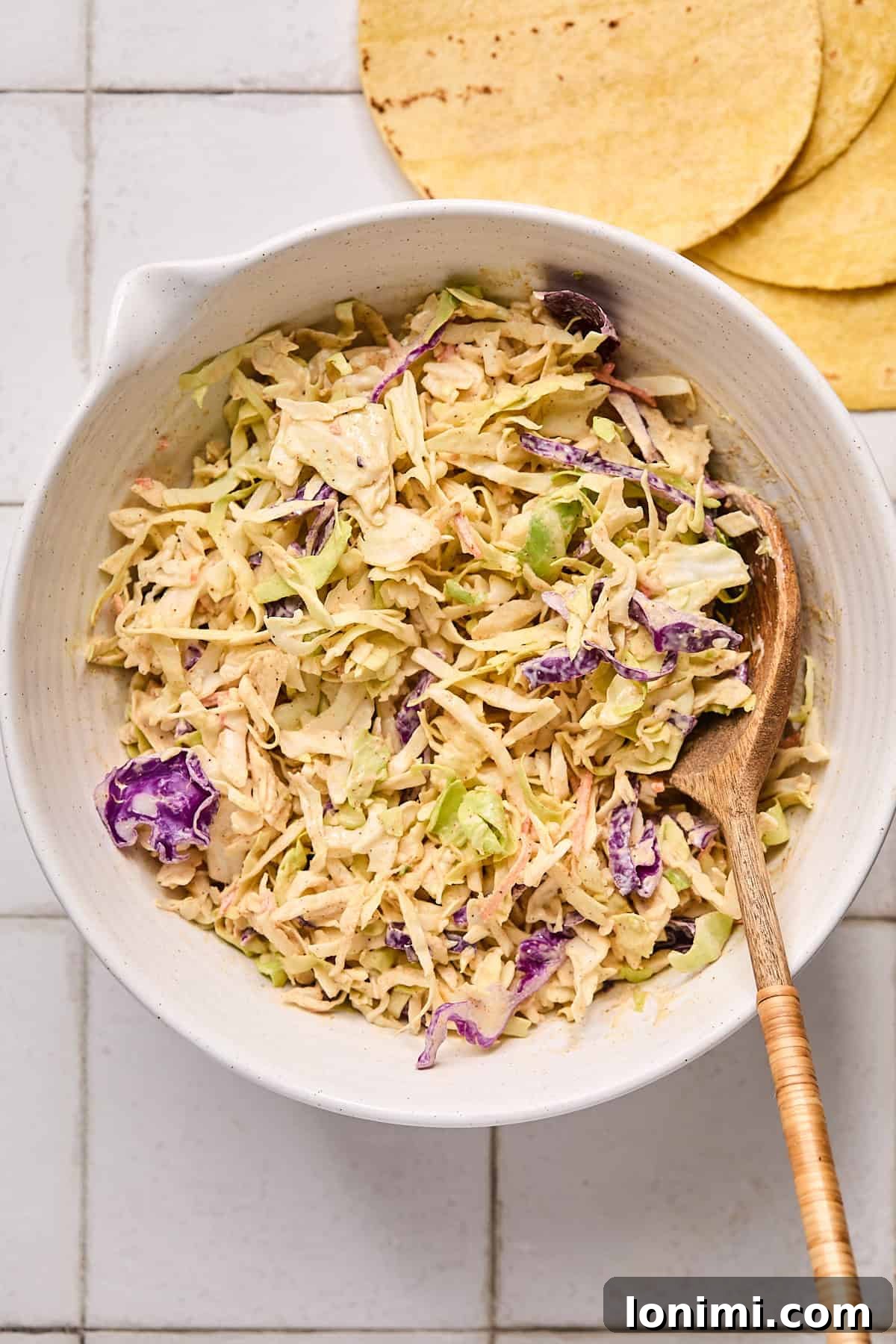 The vibrant coleslaw mix, perfectly coated in the creamy Baja sauce, showcasing a beautiful blend of colors and textures.
