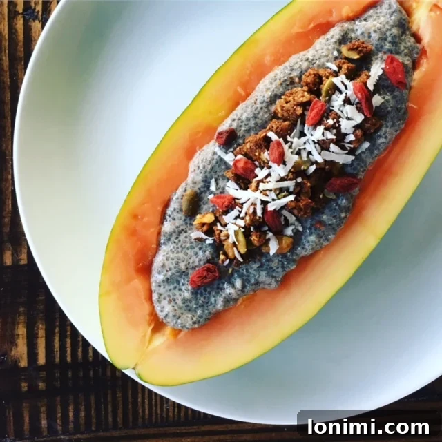 Bright and colorful chia pudding papaya boat, filled with creamy chia pudding and fresh toppings, ready for a healthy breakfast.