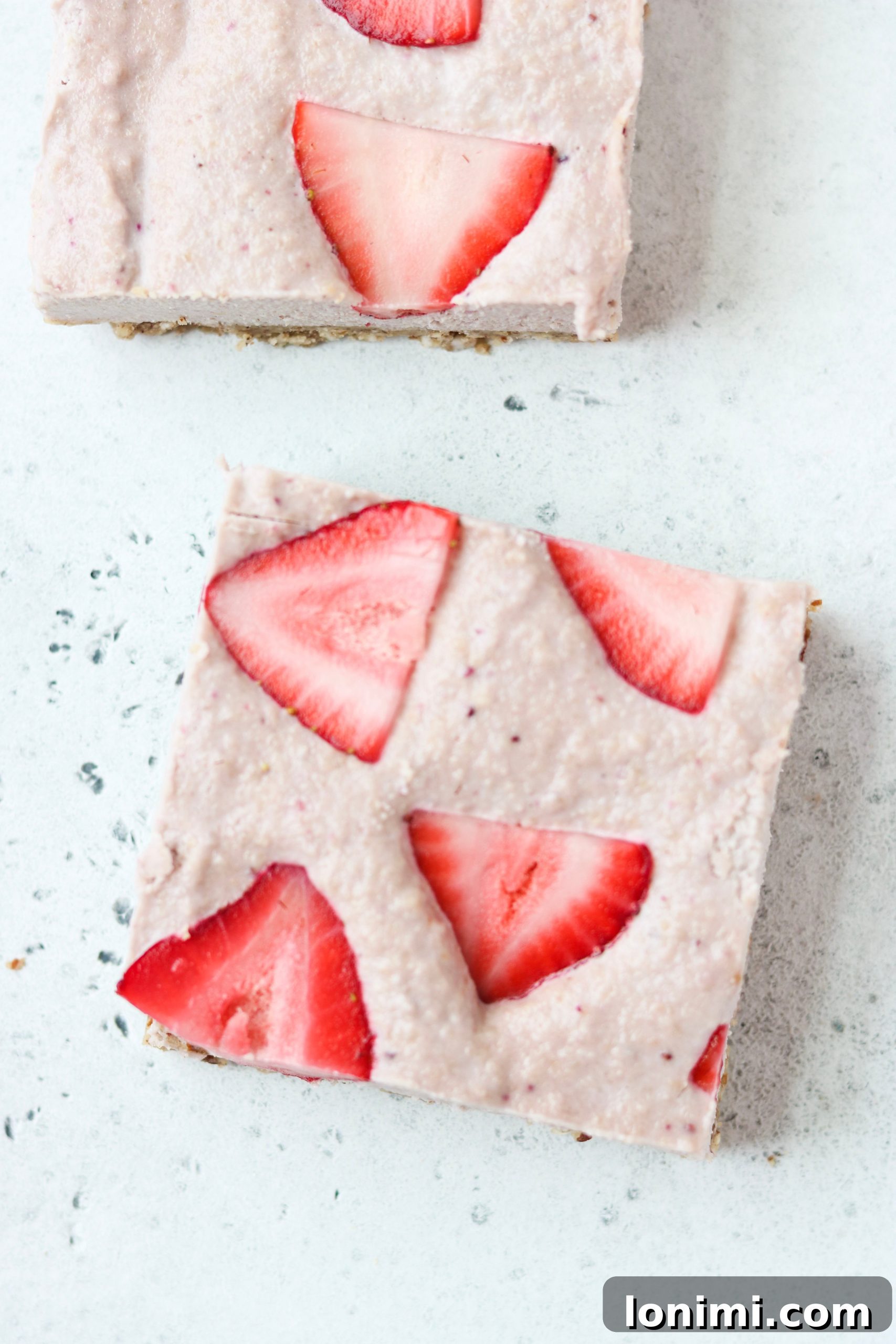 Ingredients laid out for Paleo & Vegan No-Bake Strawberry Cheesecake Bars recipe preparation