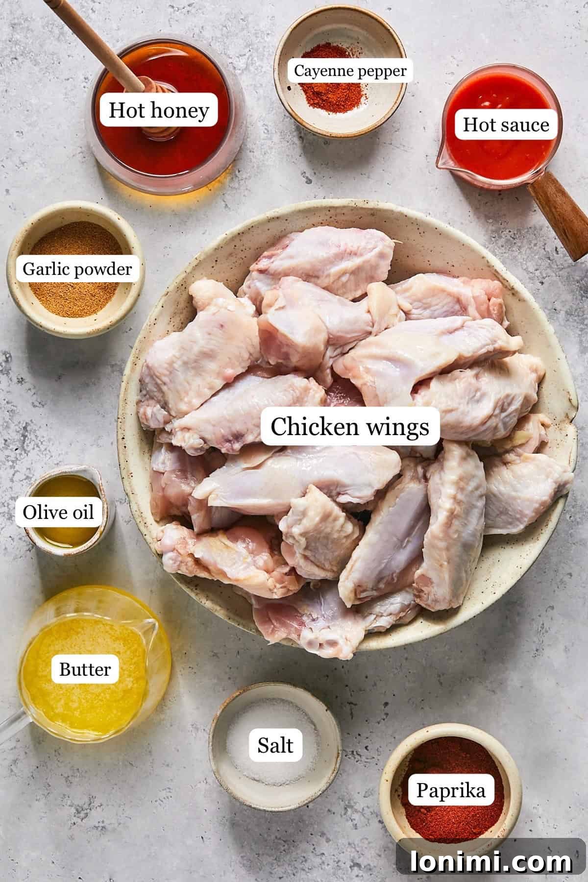 ingredients for chicken wings with hot honey sauce in nesting bowls