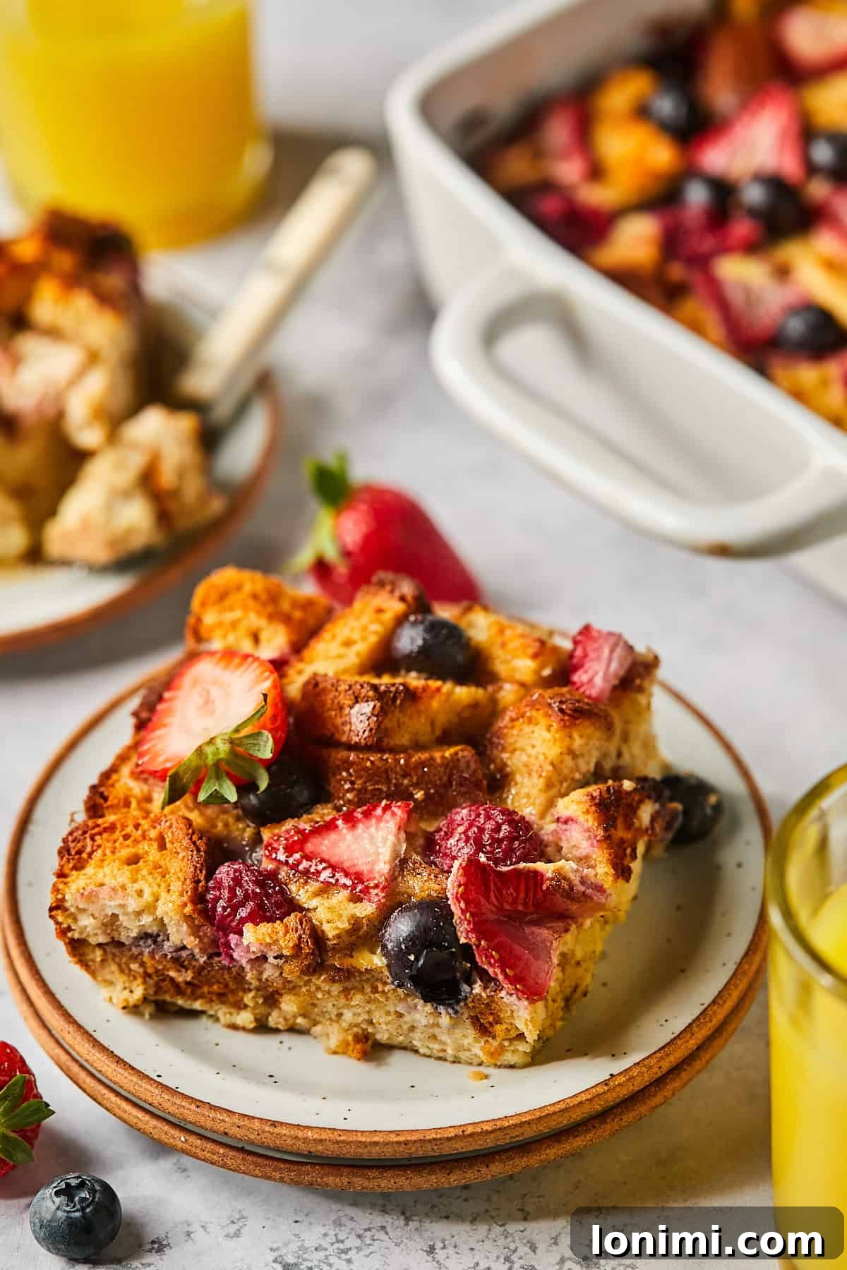 a slice of french toast casserole on a white plate. 