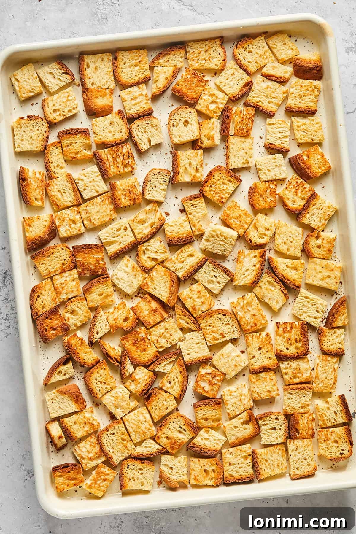 baked bread cubes on a pan