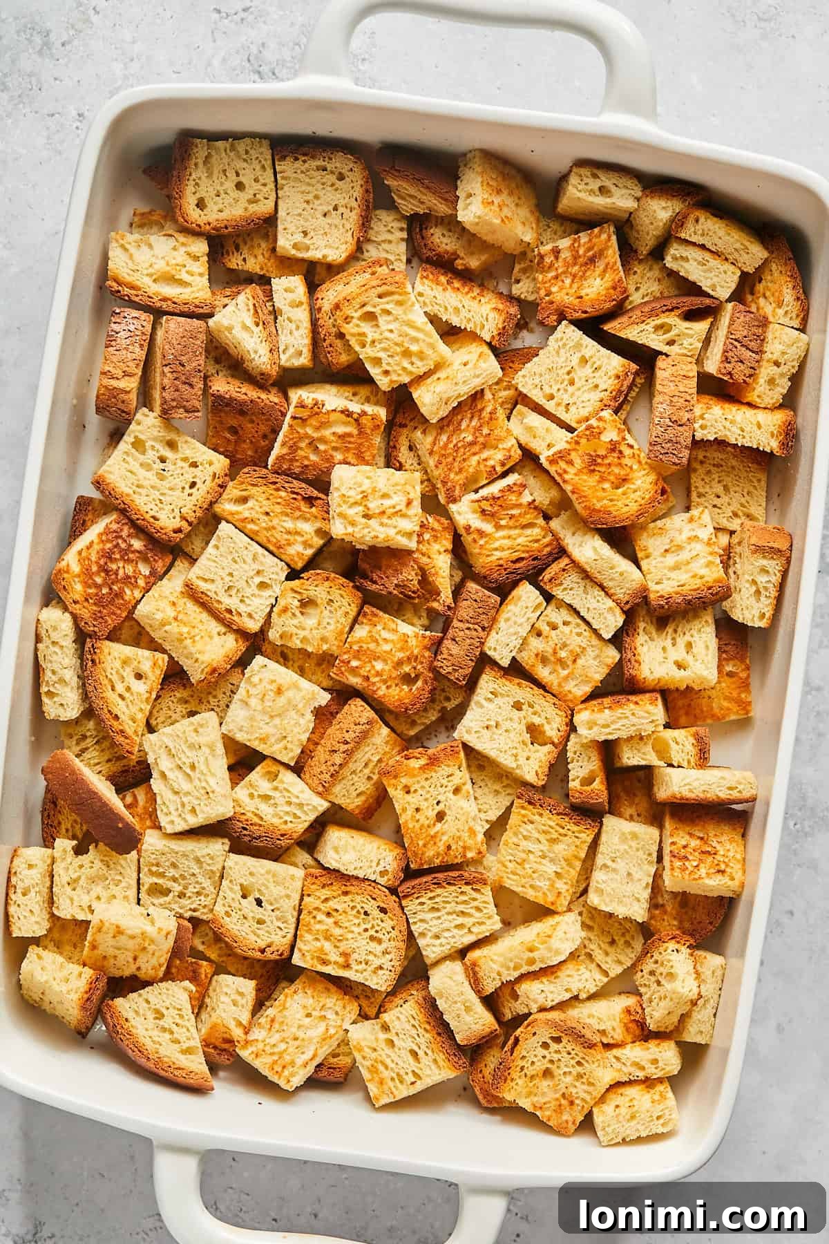 toasted bread cubes in a casserole dish