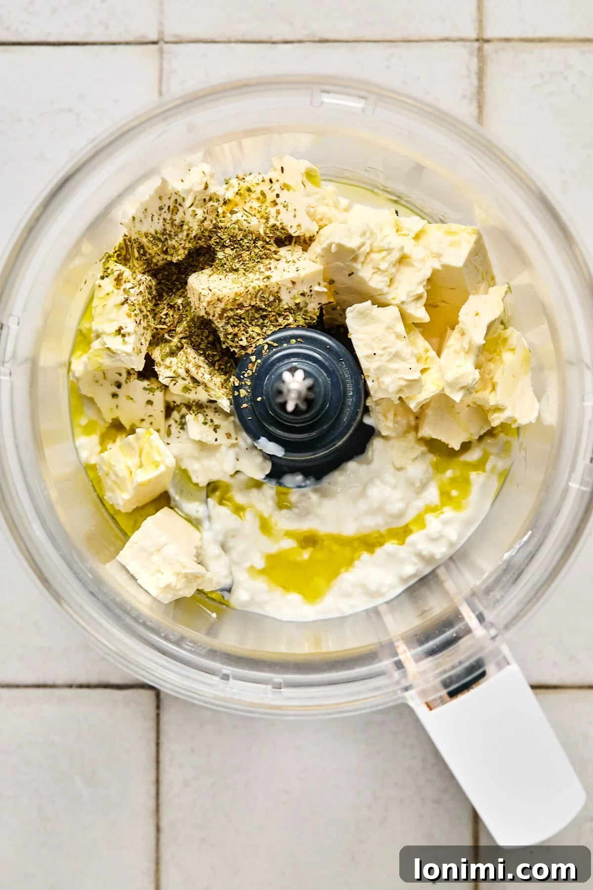 ingredients for whipped feta in a food processor