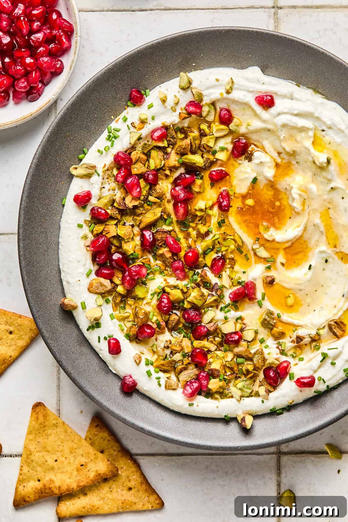 whipped feta on a plate with toppings drizzled with honey