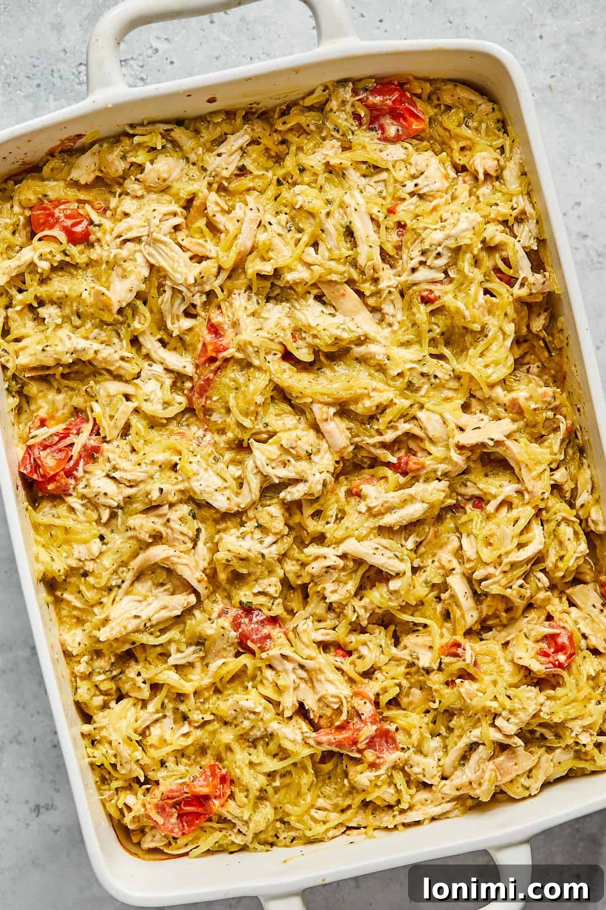 The finished Boursin chicken bake, a harmonious blend of creamy chicken, spaghetti squash, and vibrant tomatoes, ready to serve.