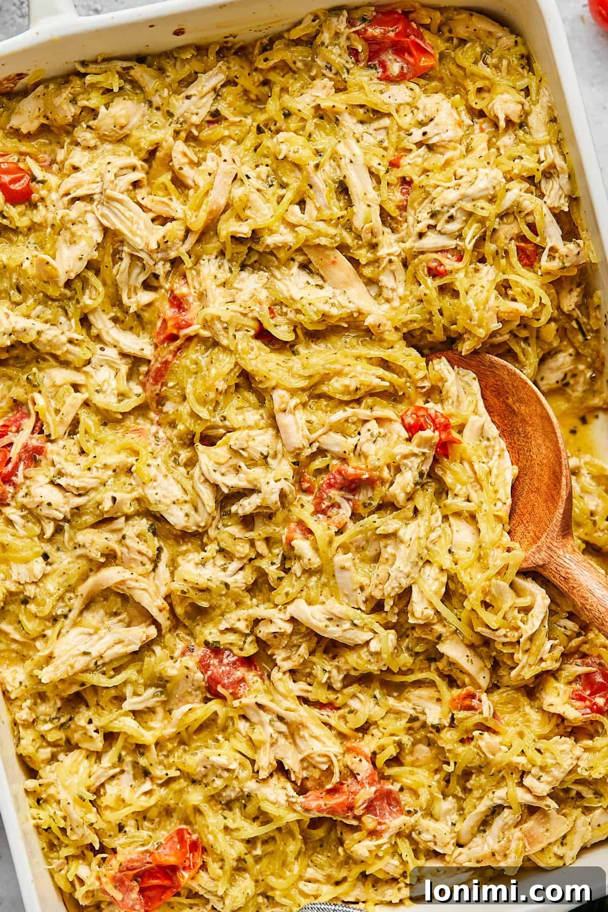 A close-up view of the rich, creamy texture of the gluten-free Boursin chicken bake, showcasing the melted cheese and tender ingredients.