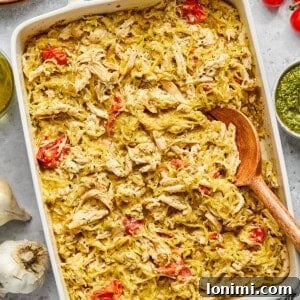 Creamy Boursin Chicken Bake with tender chicken, spaghetti squash, and roasted tomatoes in a white casserole dish.