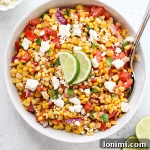 A top-down view of the Mexican Street Corn and Tomato Salad, highlighting its vibrant colors and fresh ingredients.