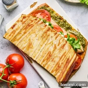 cottage cheese flatbread stuffed with fillings on a cutting board