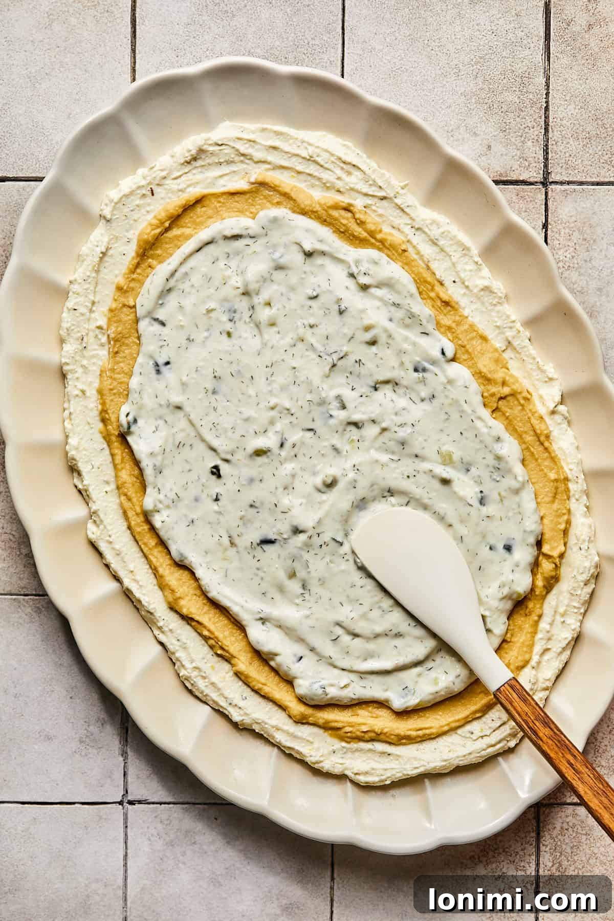 Effortless Mediterranean Layered Feta Dip 7 whipped feta with hummus and tzatziki