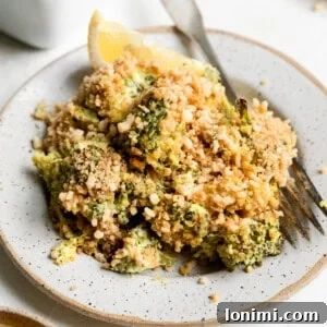 a serving of gluten free broccoli casserole on a white dish