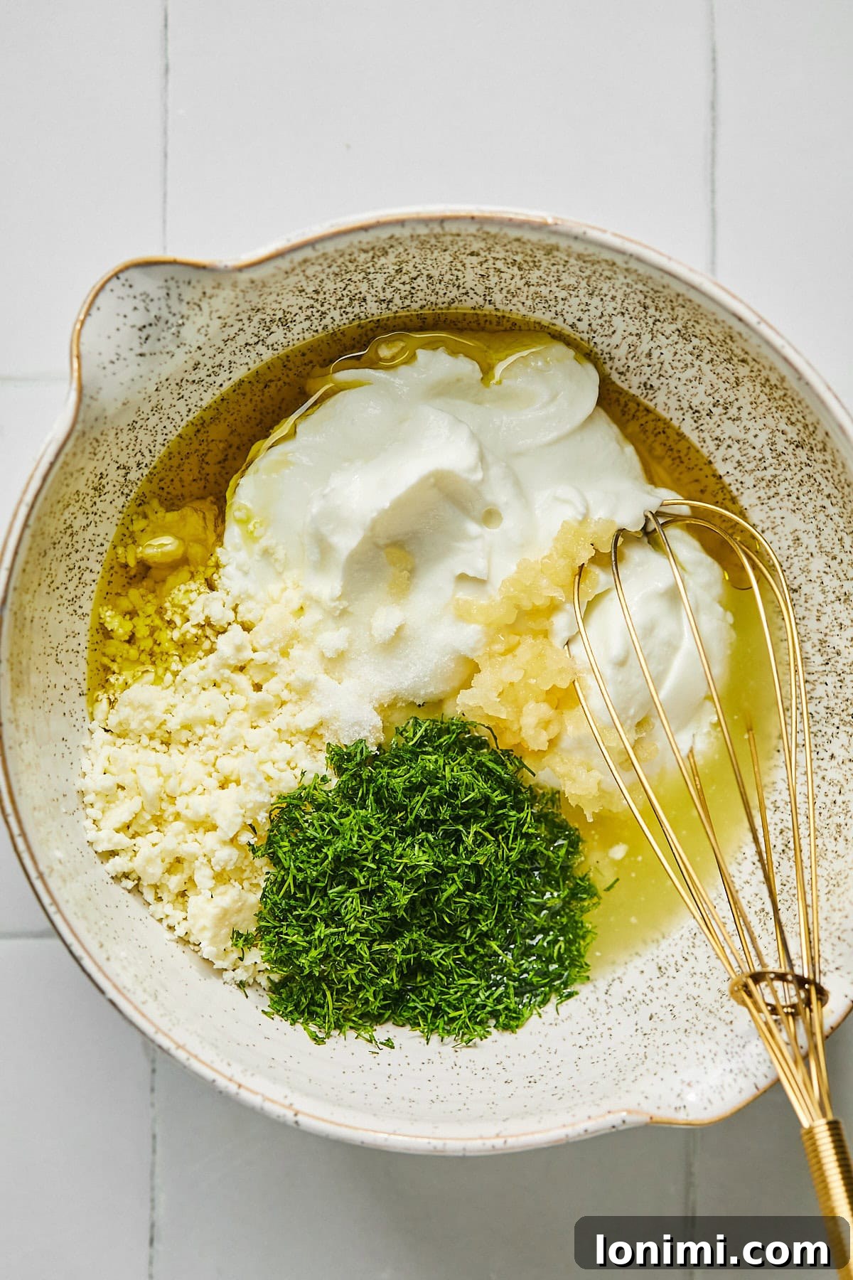 ingredients for dill yogurt sauce in a bowl