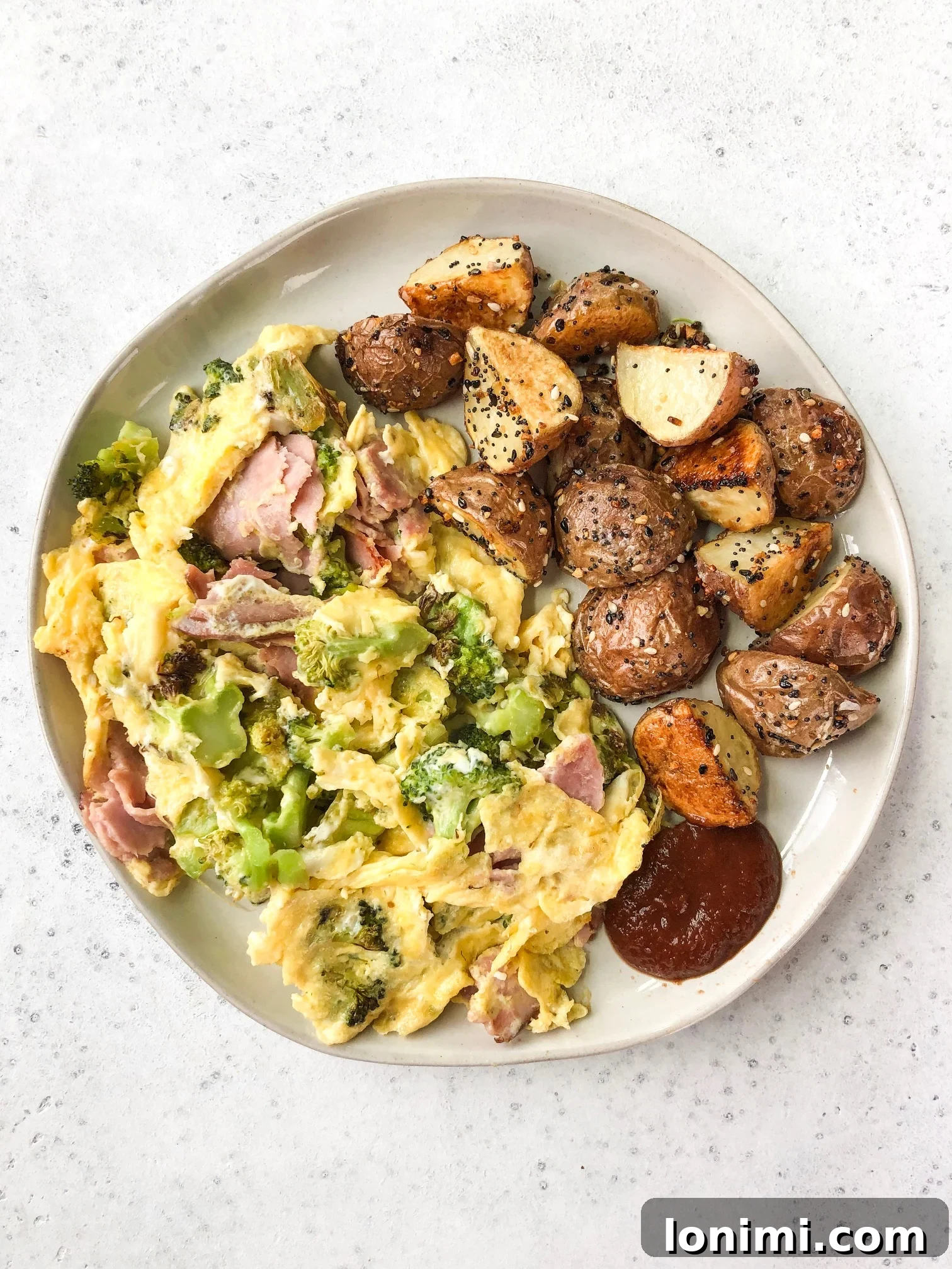 Roasted Potato Perfection 4 Diced baby red potatoes tossed with oil and seasoning in a bowl