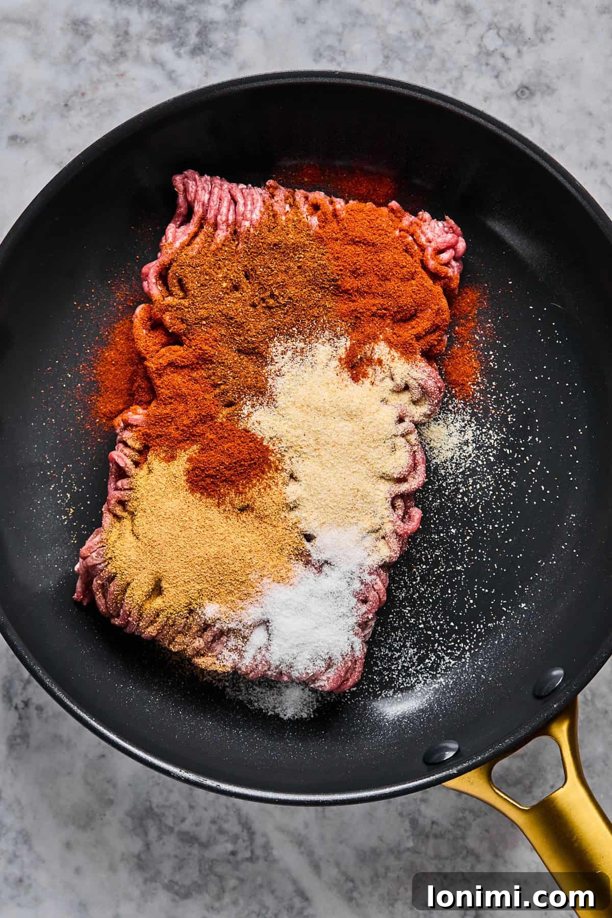The Trending Protein Power Cottage Cheese Taco Bowl 5 ground beef and spices in a skillet