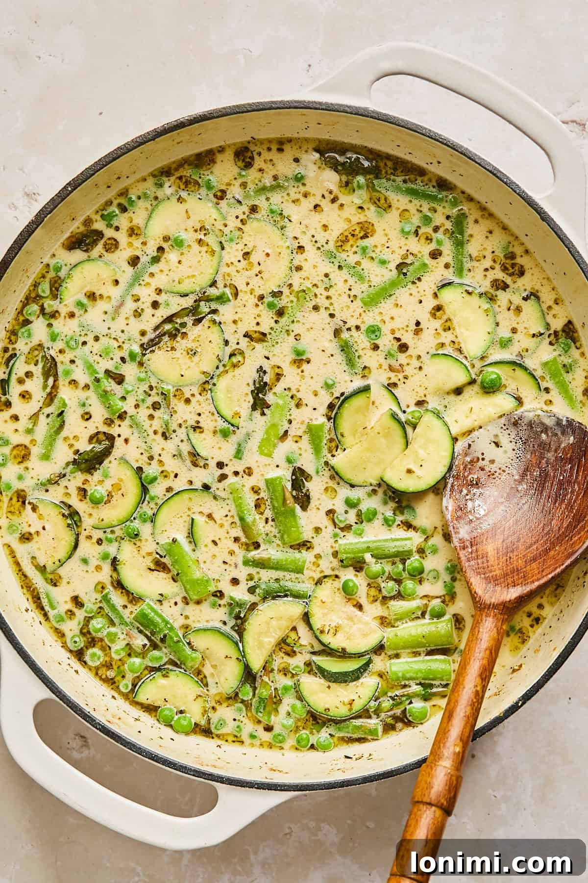 veggies in a pan with creamy sauce