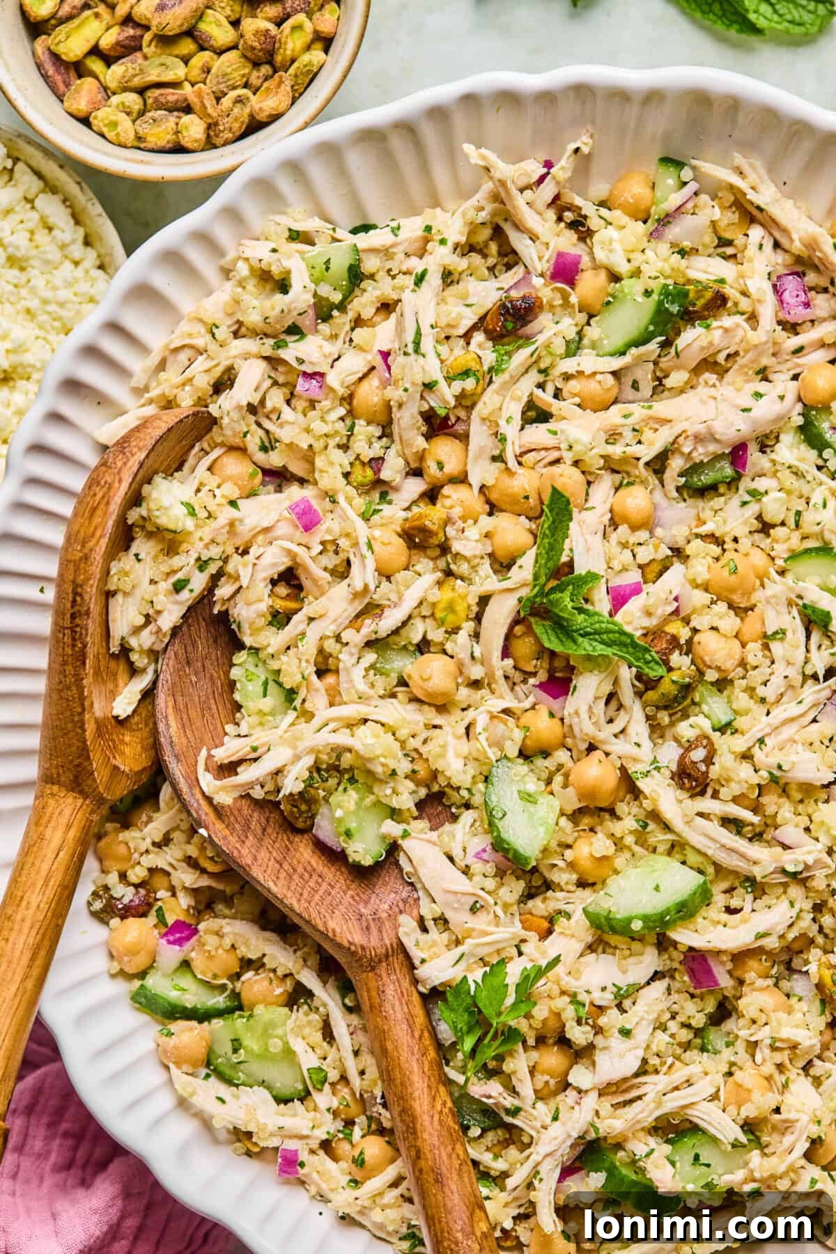 Jennifer Aniston's Go To High Protein Meal Prep Salad 2 plated high protein jennifer aniston salad with chicken, quinoa, and fresh herbs