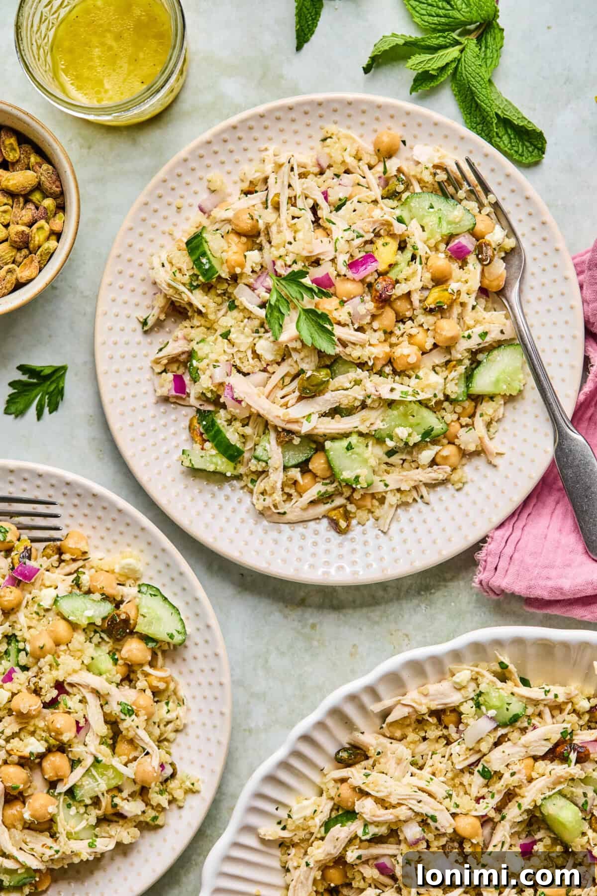 Jennifer Aniston's Go To High Protein Meal Prep Salad 7 close-up of colorful finished salad with feta, cucumber, chickpeas, and herbs