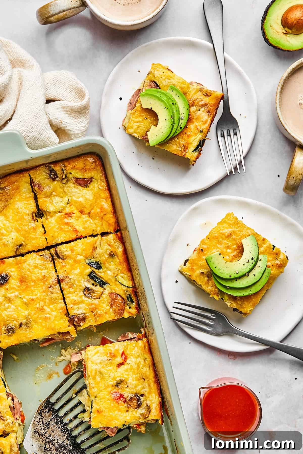 Cottage cheese egg bake in a baking dish, golden brown on top and sliced